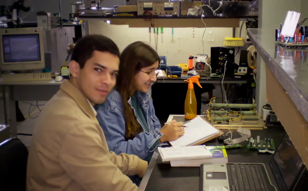 Marcos Borges (me) and my friend Ariane talking about embedded C